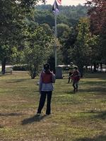 I See trees (on the Green), red pinnies, too......
